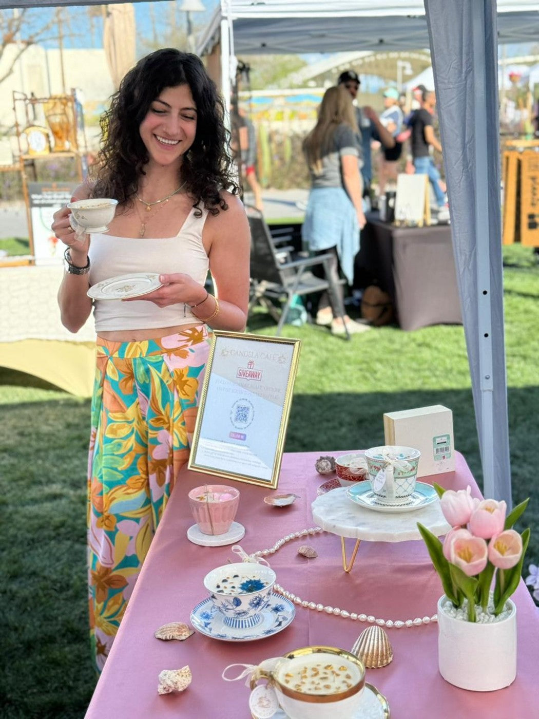 Candela Cafe market table booth setup with vintage teacup candles